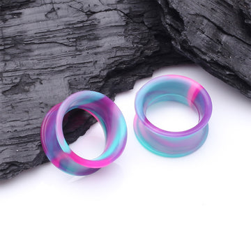 Detail View 1 of A Pair of Ultra Flexible Cosmic Flair Camo Silicone Double Flared Tunnel Plug